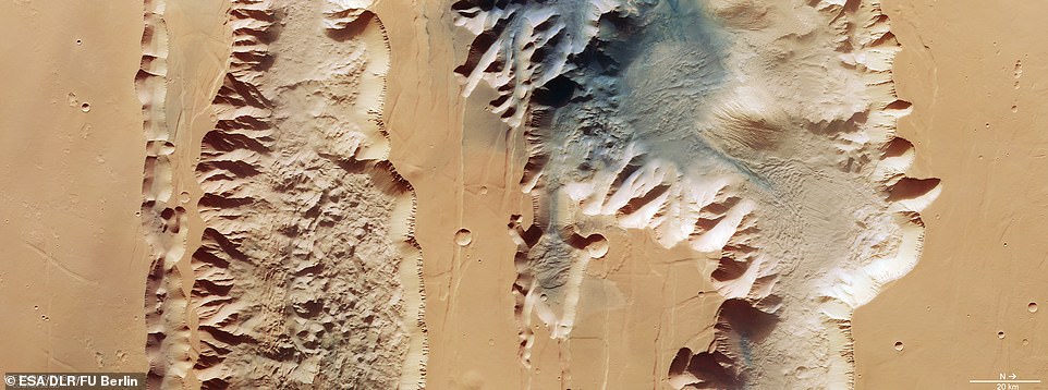 The Red Planet's massive canyon has been revealed in new images released by ESA.  The new image depicts two moats, or chasms, that form the western part of the Mariner Valley.  On the left is the Lus Chasma, 210 miles long, on the right the Tithonian Chasma.