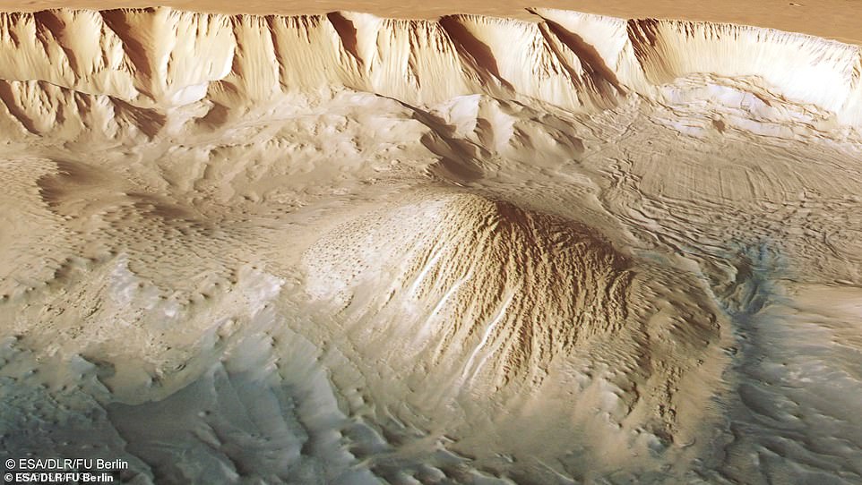 This image of Tithonius Chasma shows parallel lines and debris flows (upper right) that indicate recent landslides.