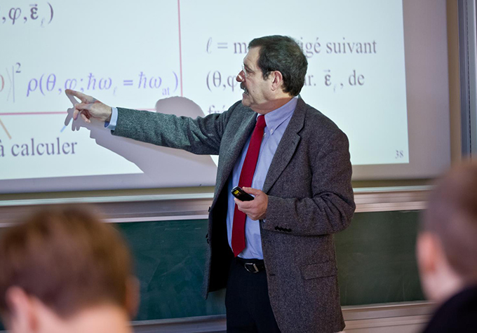 Alain looks at the equation on the projector screen