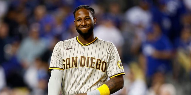 Jurickson Profar #10 of the San Diego Padres reacts after striking out in the third inning of Game 1 of the National League Division Series against the Los Angeles Dodgers at Dodger Stadium on October 11, 2022 in Los Angeles, California.