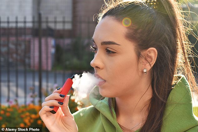 Vapers can damage the heart by restricting the airways and reducing the amount of oxygen that is pumped into the blood.  Tests found users had a weaker heart and took longer to recover from exercise (file photo)