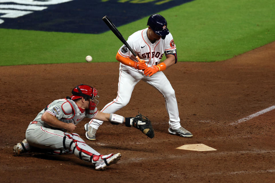 HOUSTON, TEXAS - OCTOBER 28: A wild pitch bounces away from Philadelphia Phillies' JT Realmuto #10 as Houston Astros' Aledmys Diaz #16 bats in the 10th inning of Game 1 of the 2022 World Series at Minute Maid Park on October 28, 2022 in Houston, Texas.  (Photo by Rob Carr/Getty Images)