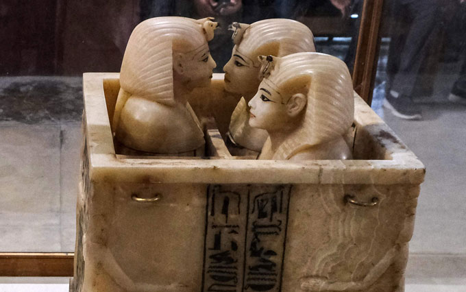 Alabaster shrine with four chambers; three of the chambers have lids shaped like Pharoah heads.