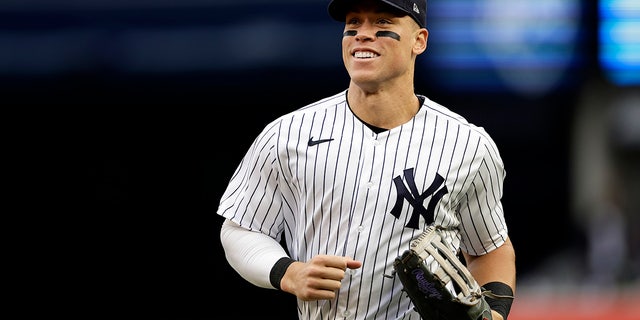 New York Yankees right fielder Aaron Judge runs for the dugout in the sixth inning of the team's baseball game against the Baltimore Orioles on Saturday, October 1, 2022 in New York City. 