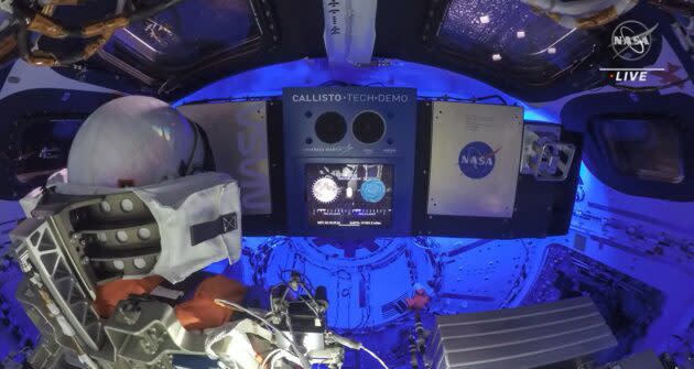 An interior view of the Orion capsule shows a decorated mannequin sensor that 'name 