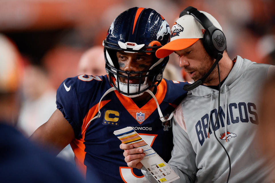 September 25, 2022;  Denver, Colorado, USA;  Denver Broncos quarterback Russell Wilson (3) talks to quarterbacks coach Klint Kubiak during the second quarter against the San Francisco 49ers at Empower Field in Mile High.  Mandatory Credit: Isaiah J. Downing - USA TODAY Sports