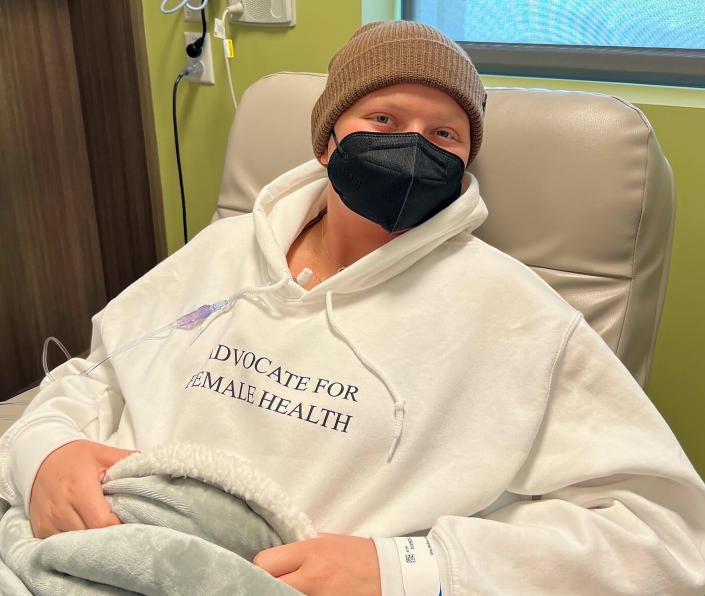 Jessie Sanders at the infusion center wearing her jacket to publicize her last chemotherapy session.  (Courtesy of Jessie Sanders)