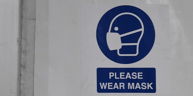 A sign urging people to wear masks at the Clark County and City of Las Vegas Joint ISO-Q (Isolation and Quarantine) Complex in the Cashman Center parking lot on April 13, 2020 in Las Vegas, Nevada. 