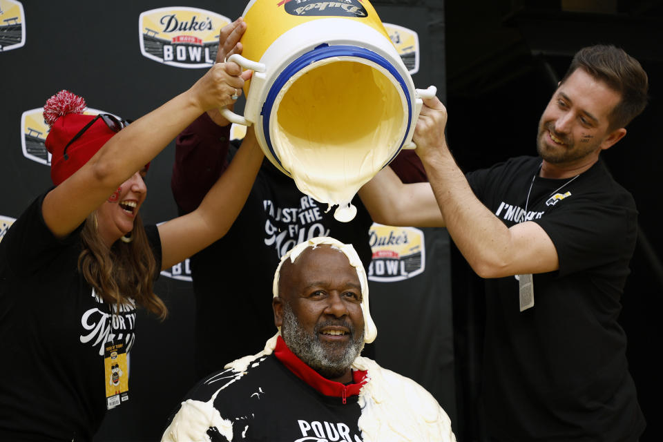 CHARLOTTE, NORTH CAROLINA - DECEMBER 30: Head Coach Mike Locksley of the Maryland Terrapins gets drenched with Duke's Mayo after defeating the North Carolina State Wolfpack 16-12 in the Duke's Mayo Bowl at Bank of America Stadium on December 30, 2022 in Charlotte, North Carolina.  (Photo by Jared C. Tilton/Getty Images)