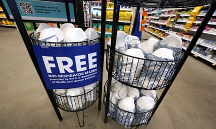A produce stall stocked with free N95 respirator masks, provided by the Department of Health and Human Services, stands outside a drug store in Jackson, Mississippi.