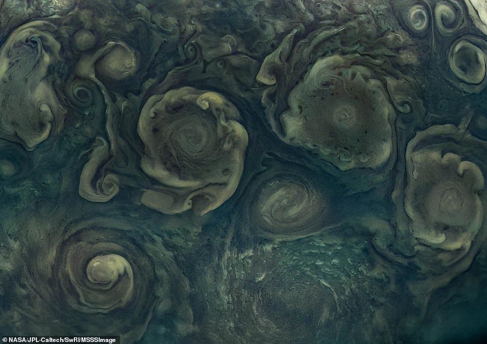 A true work of art: Juno captured colossal cyclones at Jupiter's north pole, similar to hurricanes on Earth - but move five times faster. This image was snapped in September and looks more like an oil painting than a photograph of a distant planet