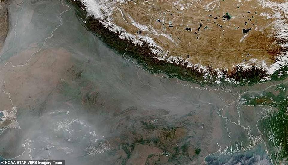 Blanket: Even darkness and smog over northern India (pictured), which experts say is caused by agricultural heat.