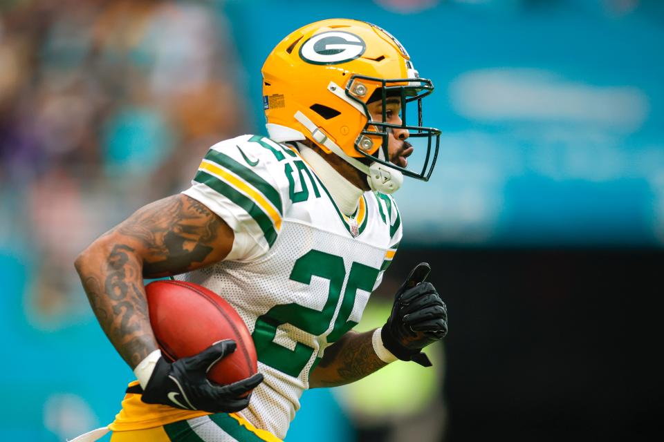 Green Bay Packers cornerback Keisean Nixon (25) completed a 93-yard kickoff return during the first quarter against the Miami Dolphins on December 25, 2022 at Hard Rock Stadium.