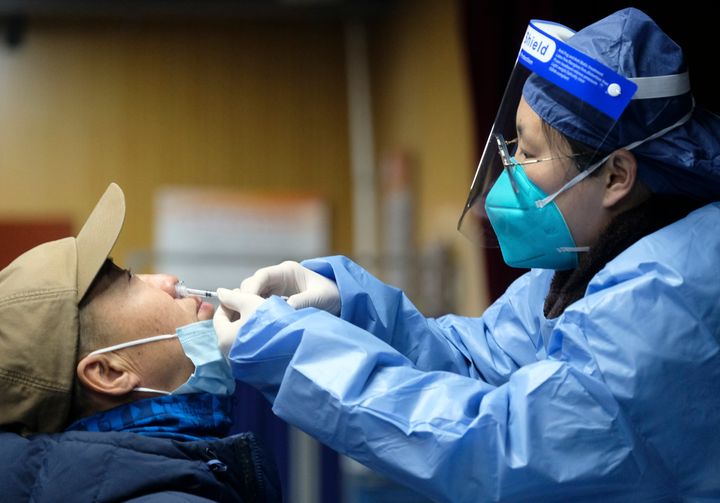 A man receives a COVID-19 nasal spray at a vaccination site in Beijing. China back in October administered what was believed to be the first inhalable COVID-19 vaccine, though little information was released on its efficacy.
