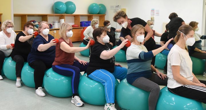 In Germany, long-COVID patients participate in motor skills training with a sports therapist. Doctors expect to have more treatments available for long-COVID patients within the next year or so.