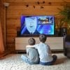 This shows two little boys watching television