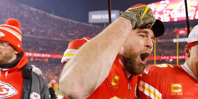 Chiefs' Travis Kelce joins his teammates in celebrating their 23-20 victory over the Cincinnati Bengals on January 29, 2023 in Kansas City, Missouri.