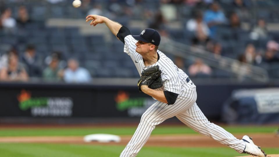 New York Yankees starting pitcher Clarke Schmidt (86) delivers a pitch during the first inning against the Tampa Bay Rays at Yankee Stadium.