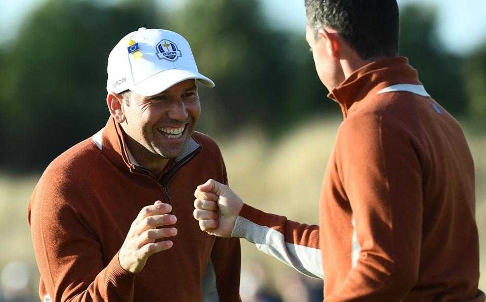Sergio Garcia (left) and Rory McIlroy (right) punch – Franck Fife/AFP