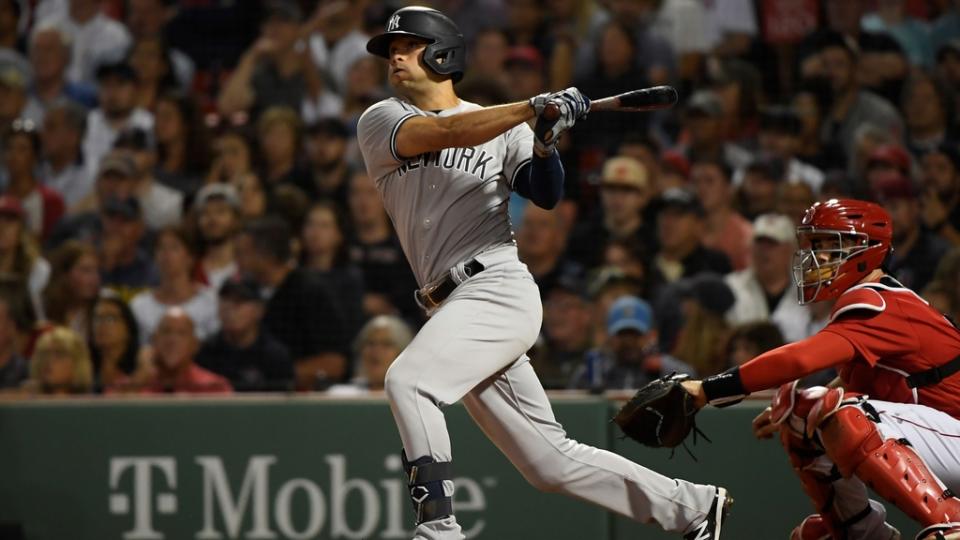 August 13, 2022;  Boston, MA, USA;  New York Yankees shortstop Isiah Kiner-Falefa (12) hits a two-run homer in the fifth inning against the Boston Red Sox at Fenway Park.