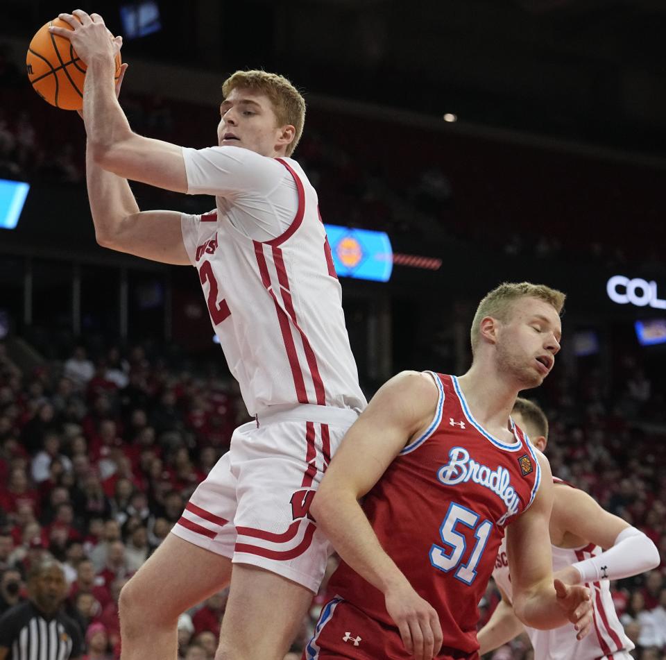 Wisconsin forward Steven Crowl grabs a rebound against Bradley forward Rienk Mast during the first half of their opener against NIT on Tuesday night at the Kohl Center.