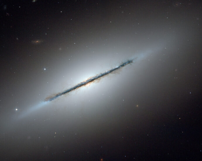 A photo of lenticular galaxy Messier 102, also known as the Spindle Galaxy.